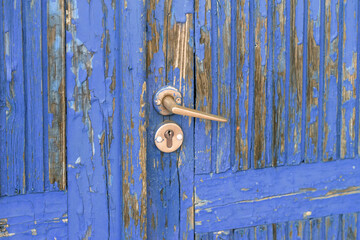 Door with blue paint peeling off