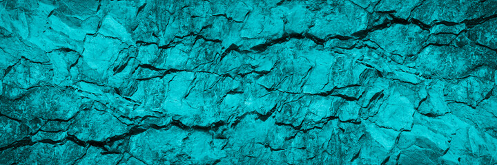 Turquoise background. Toned rock texture. Beautiful background with copy space for design. Wide banner.
