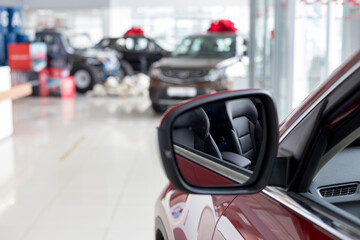 Fototapeta premium New modern unknown cars at dealer showroom. Car auto dealership. Prestigious vehicles.
