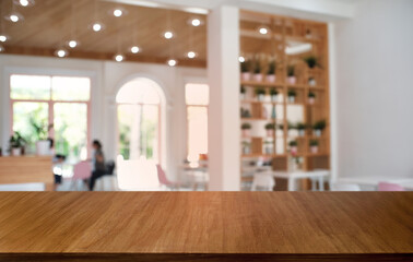 Empty dark wooden table in front of abstract blurred bokeh background of restaurant . can be used for display or montage your products.Mock up for space.