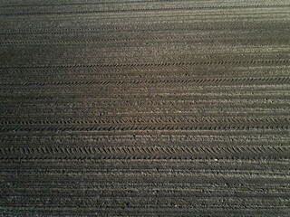 Plowed field from above. Preparation for sowing. Agricultural background