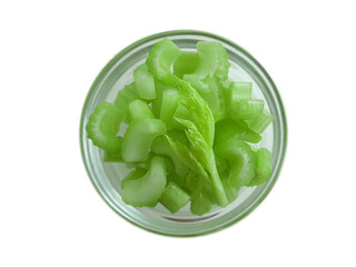 celery sliced ​​in a bowl isolated on white background