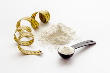 Sport whey protein powder in scoop. Sport nutrition