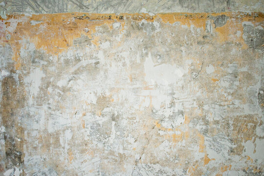 Scratched, Cracked, Flooded And Bruised Wall In An Old Industrial Room (basement Or Warehouse). Industrial, Texture Or Wallpaper Background With Brick And Stains