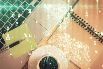 Double exposure of data theme drawing hologram over topview work table background with computer. Concept of technology.