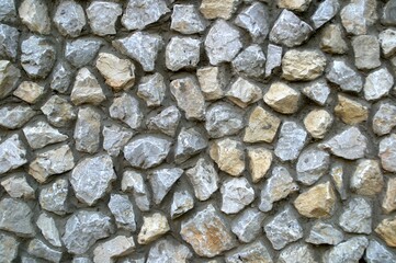 Mosaic of stones. Gray and multicolored stones