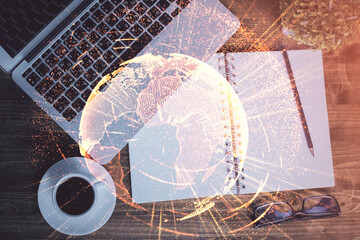 Social network hologram drawings over computer on the desktop background. Top view. Double exposure.