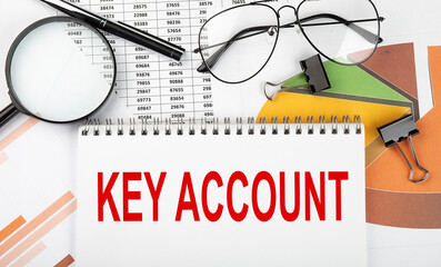Text KEY ACCOUNT on white paper notebook on the diagram. Business concept