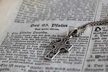 close up of an old bible with celtic cross