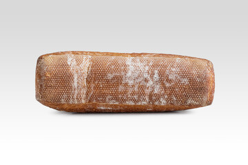 Textured bottom crust of a floured mini baguette