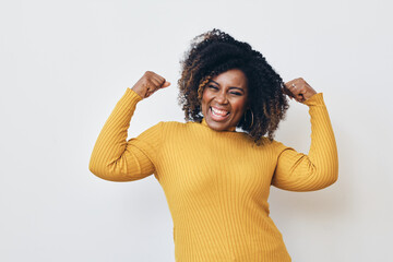 Cheerful strong woman flexing muscles against white background - obrazy, fototapety, plakaty