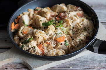 Rice pasta with vegetables and meat.