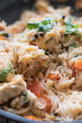 Rice pasta with vegetables and meat.