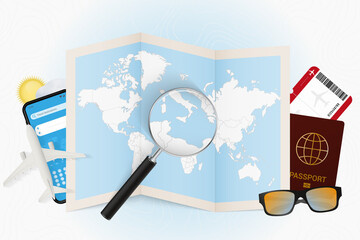 Travel destination Malta, tourism mockup with travel equipment and world map with magnifying glass on a Malta.