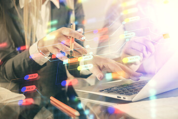 Double exposure of man and woman working together and technology theme drawing hologram. Big data concept. Computer background.