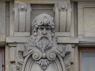 Fragment of the facade of a beautiful old building, architectural decor 