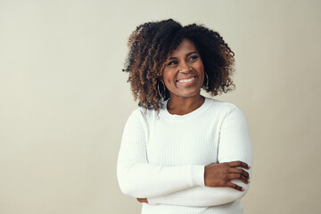 Looking up at copy space African American Smiling Woman Wearing a white sweater - Powered by Adobe