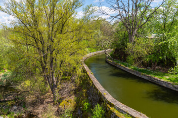 Artificial canal with trees along the banks 