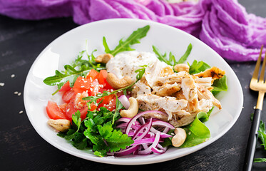 Healthy vegetable summer salad, fresh vegetables and chicken breast with yogurt dressing. Keto, ketogenic diet.