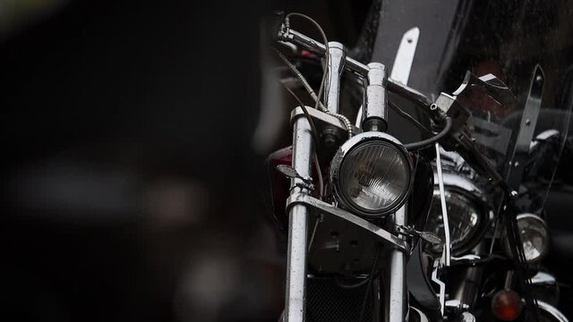 Cinematic close up slow motion of motorcycle headlight