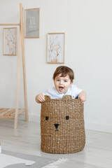 little child sitting on a basket