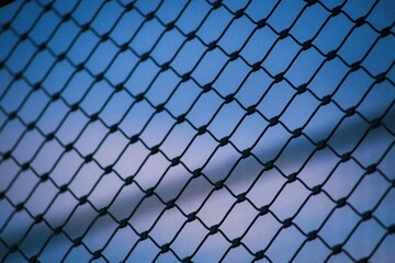 Fototapeta premium chain link fence with blue sky
