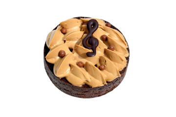 Festive chocolate cake with coffee cream, small chocolate balls and treble clef, isolated on white background. Original cake for musicians 