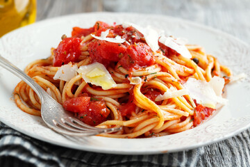 Tomato pasta with cheese on plate