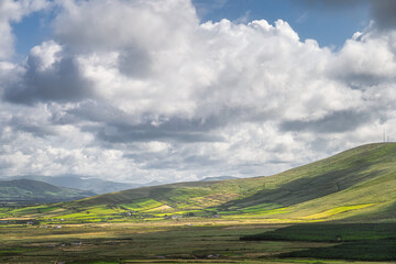View from Kerry Cliffs on nearby hills covered in green fields, pastures and farms, Iveragh peninsula, Portmagee, Ring of Kerry, Ireland