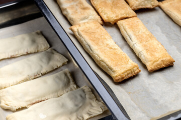 uncooked sweet pastry bun at a cooking tray. homemade cooking concept