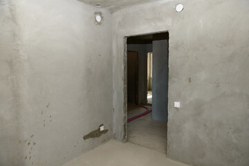 Rooms of the apartment in a new building with rough finishing