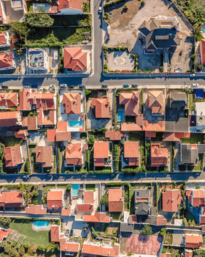 Aerial view of red rooftop in Praia das Macas residential district, Colares, Portugal.