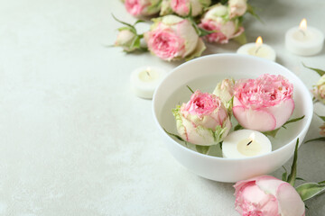 Romantic concept with roses on white textured table