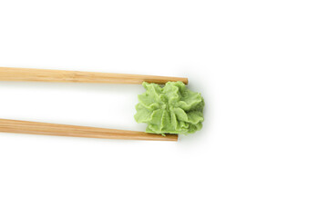 Chopsticks with wasabi isolated on white background