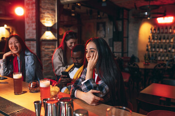 Group of friends watching sport match together. Concept of friendship, leisure activity, emotions