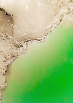 Aerial view of a green pool used for slag disposal in Artemovsky industrial area, Primorsky Krai, Russia.