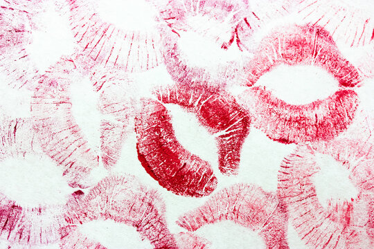 A lot of red kisses isolated on white background. Female lip prints on paper. Lipstick kisses. Print of lips. Beautiful lips stamps. Valentine's day, romantic mood and love concept. Kiss and love you.