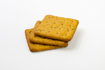 Crackers with bran and spicy herbs. Isolated on white background.