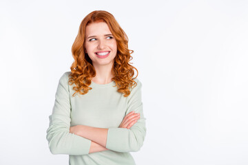 Fototapeta premium Photo portrait of red haired woman with folded hands smiling looking empty space curious isolated white color background