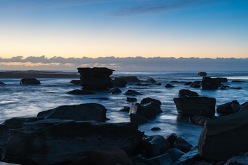 Sunrise seascape in the rocky alcove