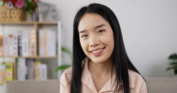 Smiling asian young woman