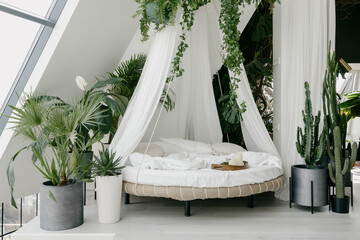 White bedroom with boho chic interior design