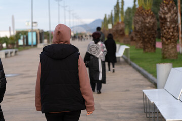 Batumi, Georgia - May 12, 2021: People stroll along the embankment