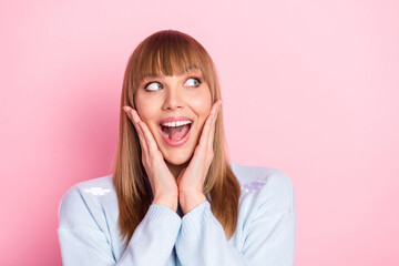 Portrait of attractive cheerful amazed curious girl enjoying great news copy space isolated over pink pastel color background