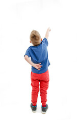 Back view of little boy points at wall. Rear view. Isolated on white background
 - obrazy, fototapety, plakaty