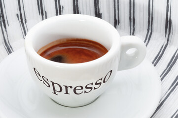 Cup of espresso with Italian language logo 