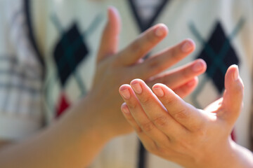 Deaf asia woman using sign language.