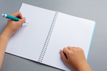 a woman left-hand with a pen.Left hander day concept.