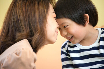 Asian mother is teasing with her son. Quality family time concept. Closed up shot.