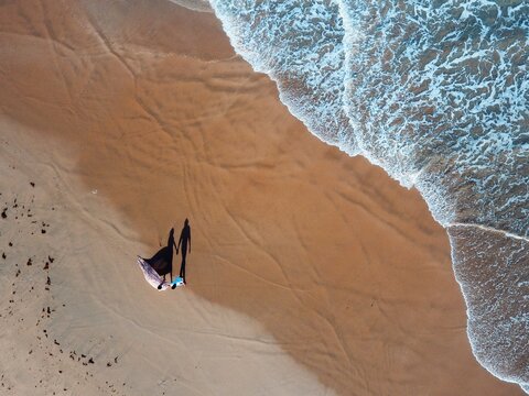 High Angle View Of A Couple On A Beach
